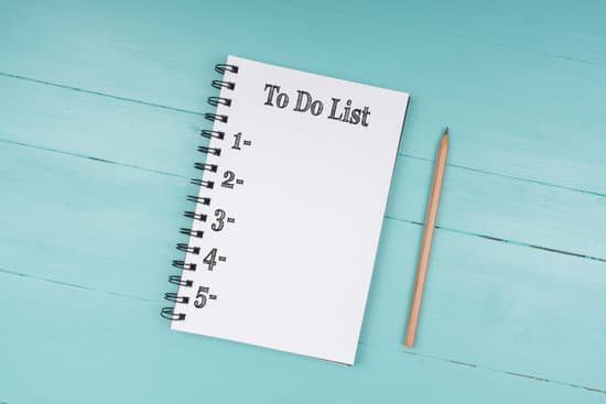 15 Work From Home Tips And Tricks To Be Successful Image of a notebook with a to-do list on it for working from home.