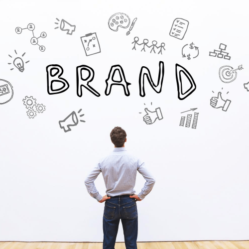 Personal Branding: 11 Tips For Creating A Professional Image Image of a professional man looking at the word brand for building a personal brand.
