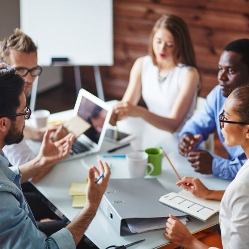 Image of co-workers having a group discussion for lead a group discussion tips section.