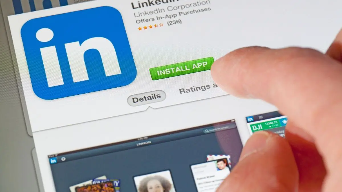 Image of person installing LinkedIn app for LinkedIn profile tips and checklist article.