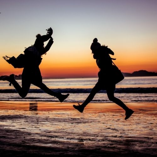 4 Areas Of Personal Development For Success Image of two people jumping for personal growth and the areas of personal development.