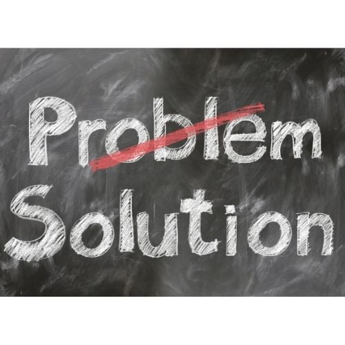 4 Areas Of Personal Development For Success Image of a board with problem crossed out and solution written on it.
