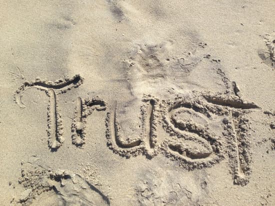 Image of trust written in the sand for the how to delegate tip 1.