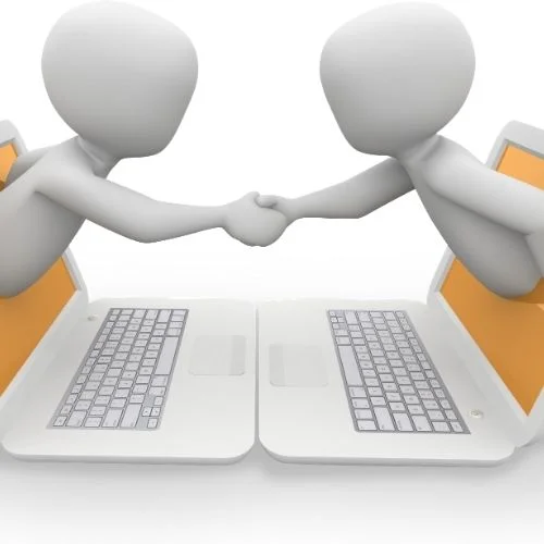 How to Run Effective Staff Meetings! 5 Easy Steps Image of two people reaching through a computer shaking hands for digital meeting services section.