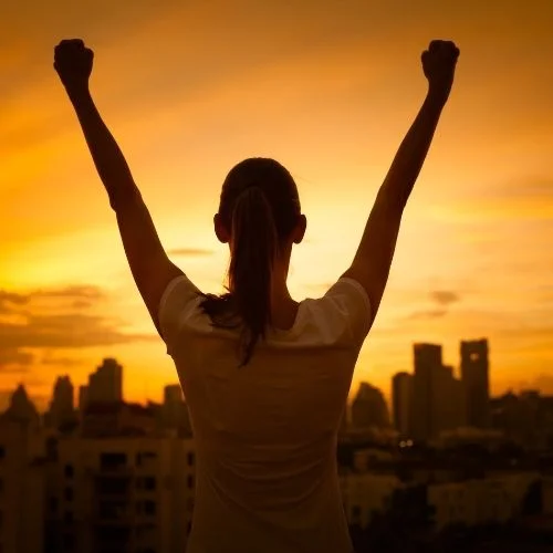 22 Tips to Make Your LinkedIn Profile Stand Out Image of woman celebrating success.