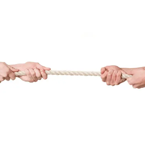 Image of a tug of war representing the leverage negotiation skills.