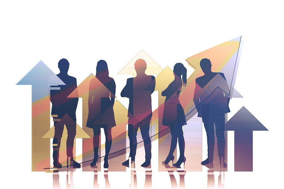 Complete Guide to The 5 Stages of Group Dynamics Image of teamwork Team Arrows representing the performing stage of group development