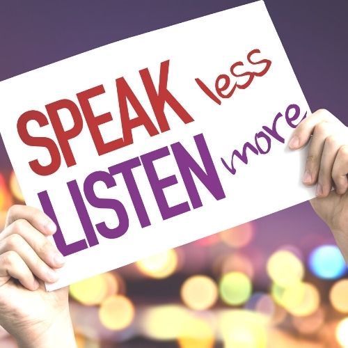 Image of a sign that says speak less listen more.