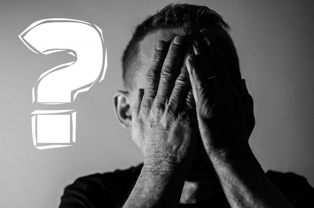 13 New Supervisor Tips to Get Started On the Right Foot Image of a man covering his face representing a new supervisor, leader, boss, manager mistake for factors to avoid as a new supervisor section. Tips for a new supervisor.