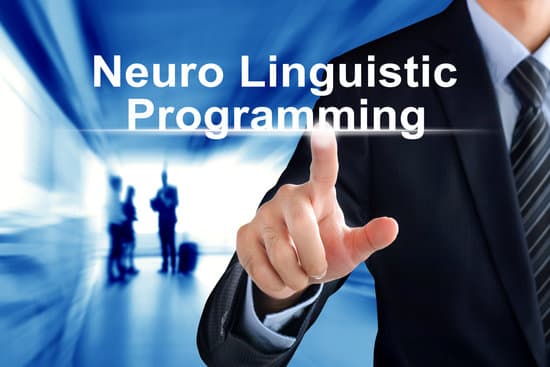 Man pointing at the words Neuro Linguistic Programming (NLP). Use NLP to reduce stress at work.