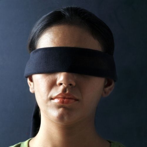 Image of a person blind folded for the Blind Retriever team building game.