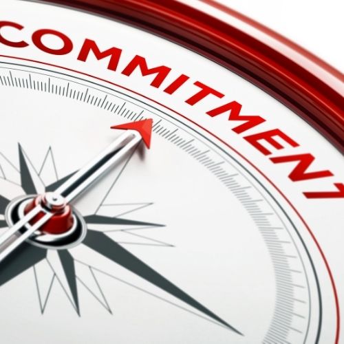 Image of a compass pointing to commitment.