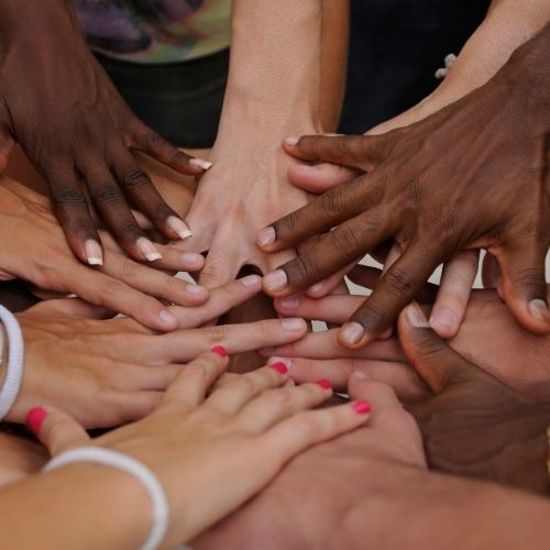 Images of hands together from multiple colors and races for diversity section.