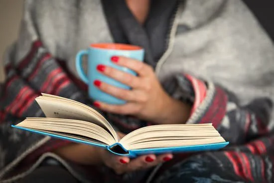 How to Be More Productive In Life: 14 Actionable Tips Image of a woman using her downtime to read a book and grow as a person.