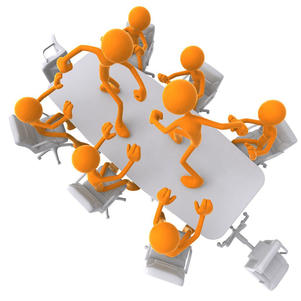 How to Resolve Conflict in the Workplace: 20 Effective Tips Image of a meeting with two figures on a table about to fight representing poor managing conflict in the workplace.