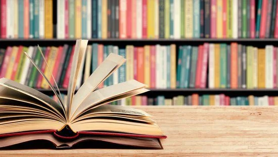 How to Achieve Personal Growth and Maximize Self-Improvement Image of a lot of books for personal growth.
