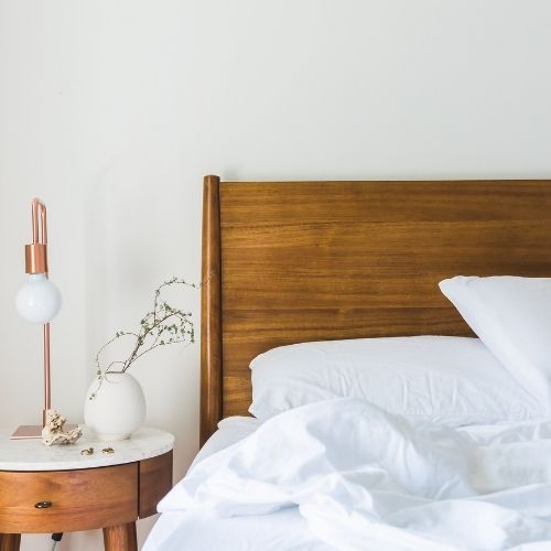 How to Fall Asleep Faster: Simple Secrets for Better Sleep Image of a bedroom with a comfortable-looking mattress.