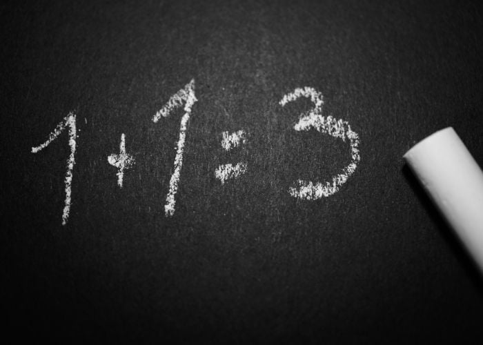 chalkboard with 1+1=3. representing a mistake.