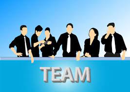People in business suits, working together as a cohesive team.