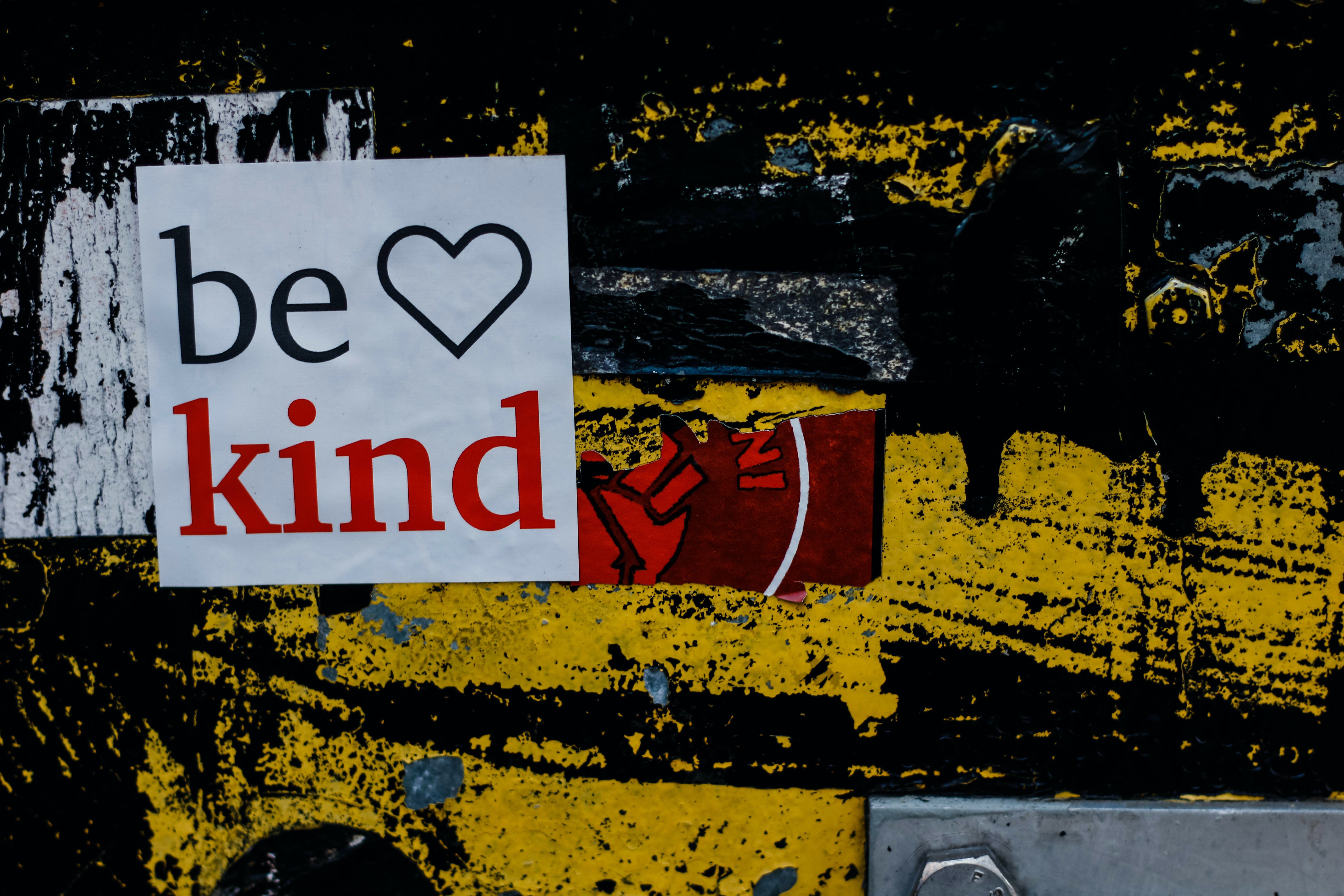 sign that says be kind