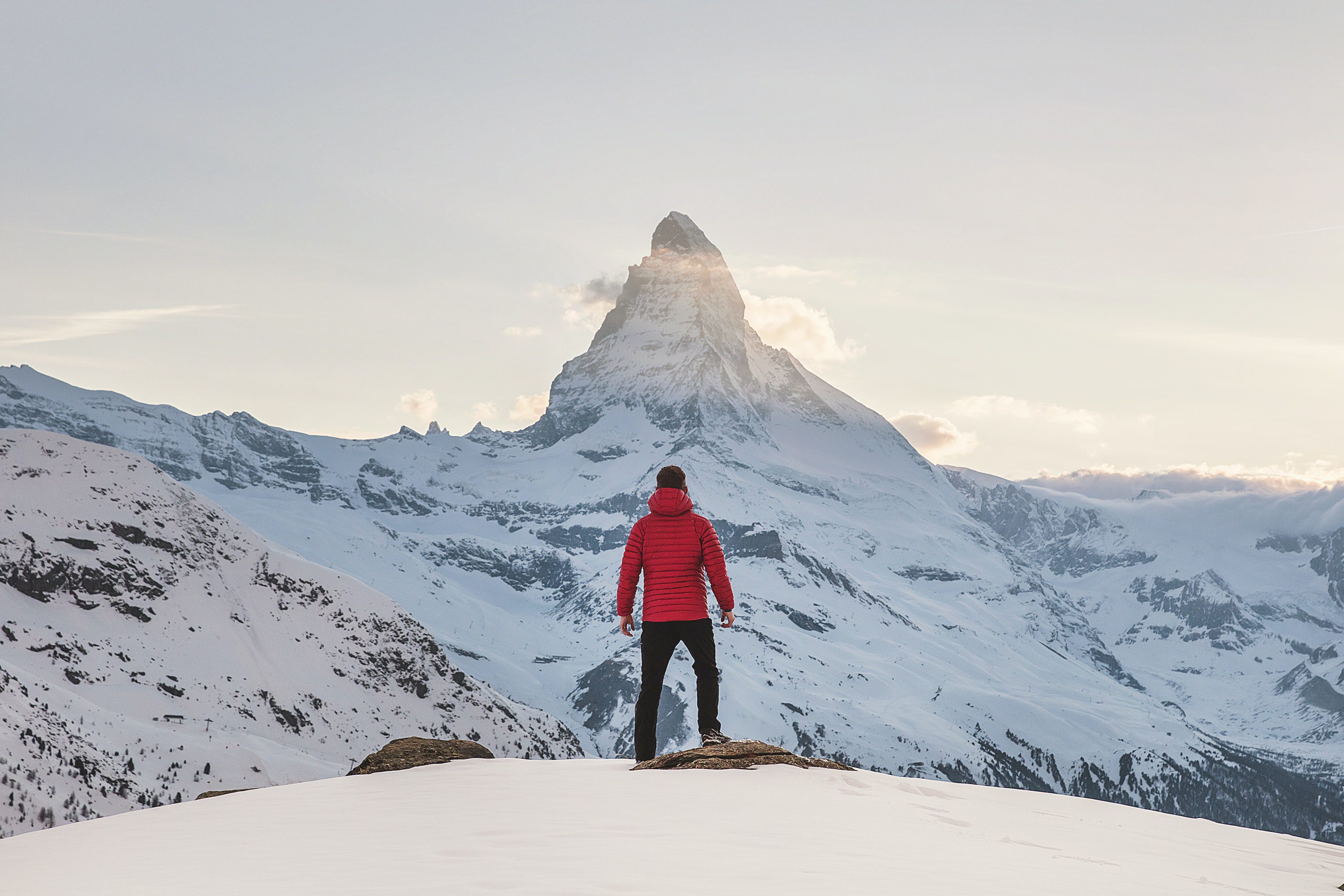 What Is a Personal Mission Statement? How to Write Yours Man looking up at a mountain contemplating his personal mission.