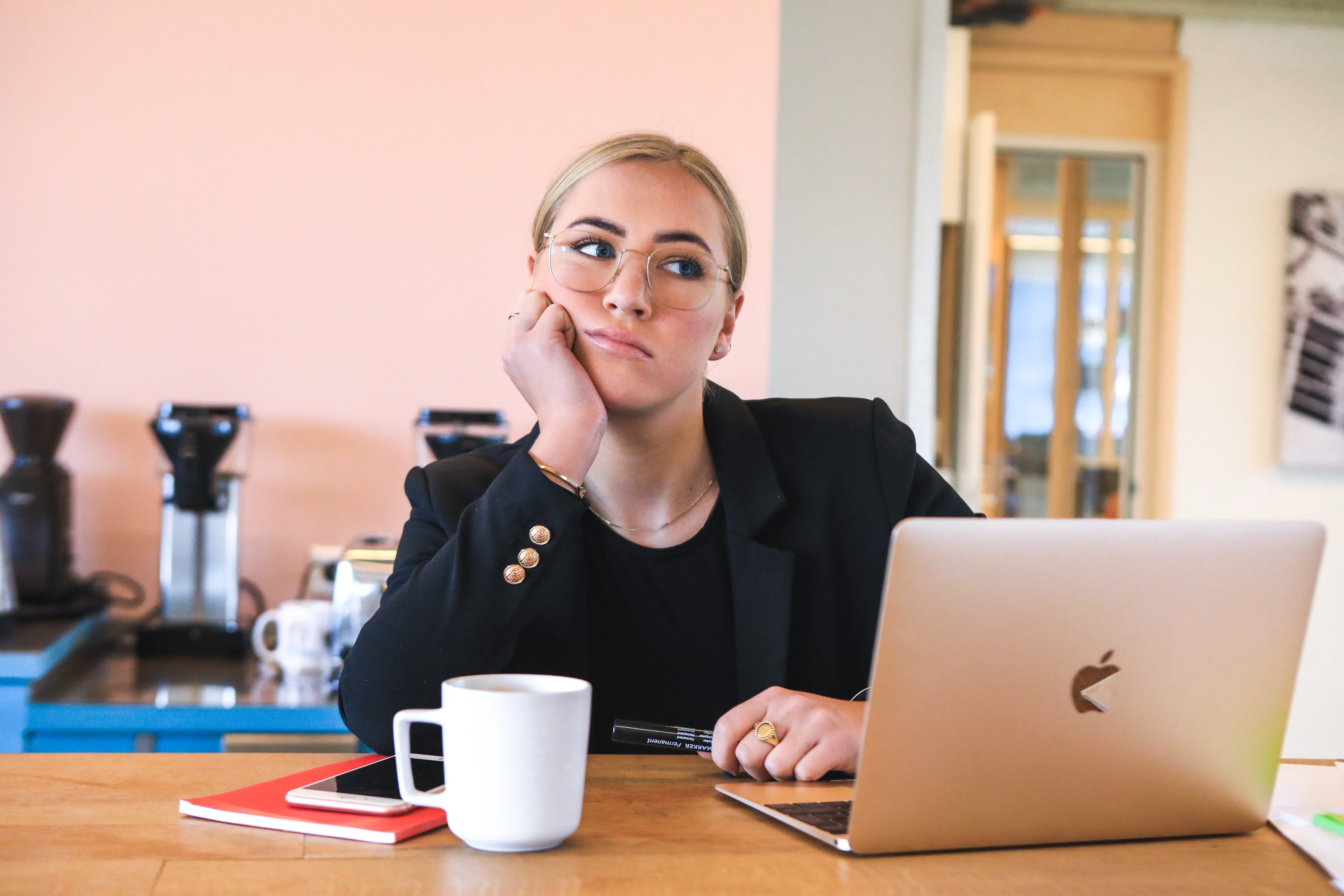 Lady sitting with a bored look on her face.