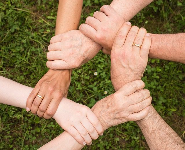 People with interlocked arms.