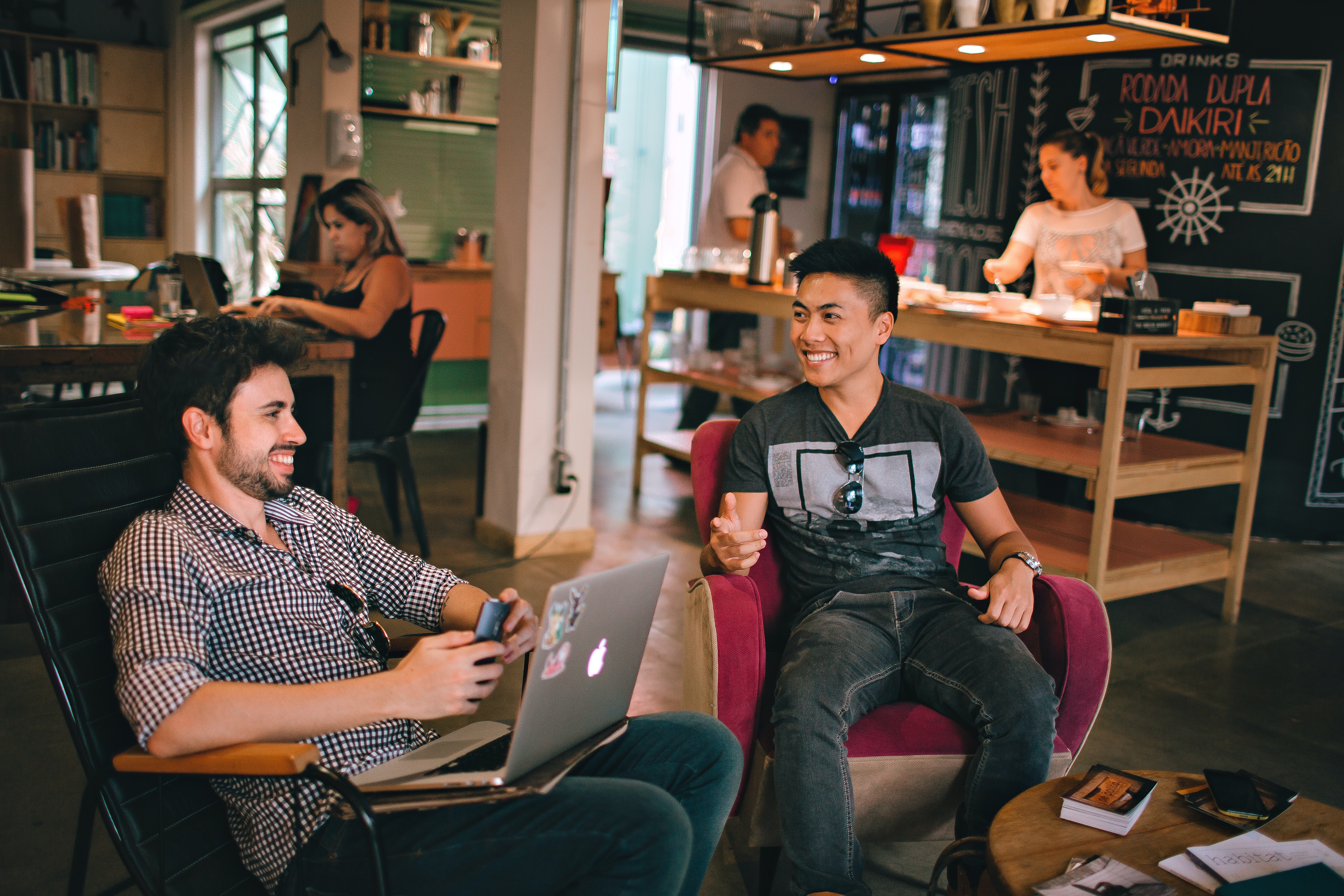 The Importance of Networking: How to Build Yours Two people talking in a coffee shop showing the importance of networking