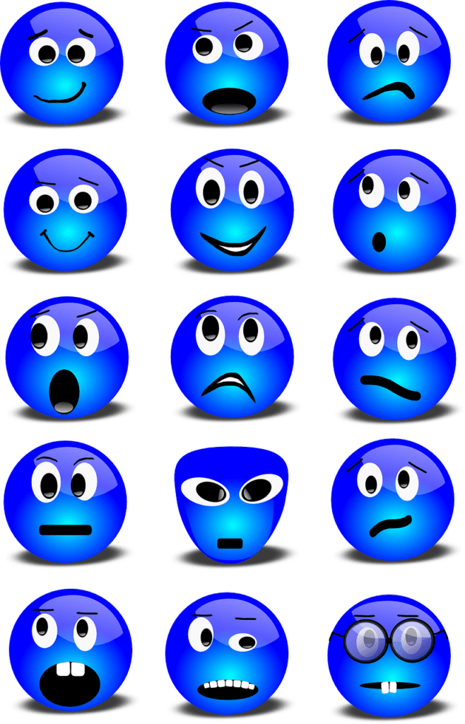 15 Communication Barriers: How To Overcome Them different emojis showing emotions which can be a barrier to communication.