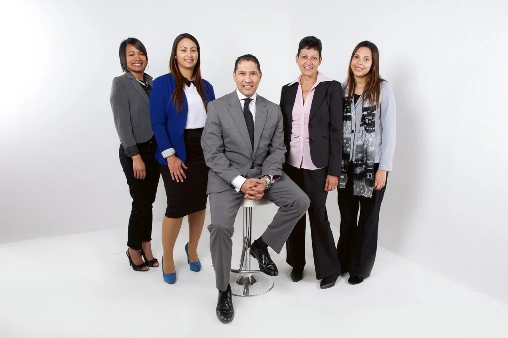 Building a Team from the Ground Up: Ultimate Guide A successfully built work team grouped together in a photo.
