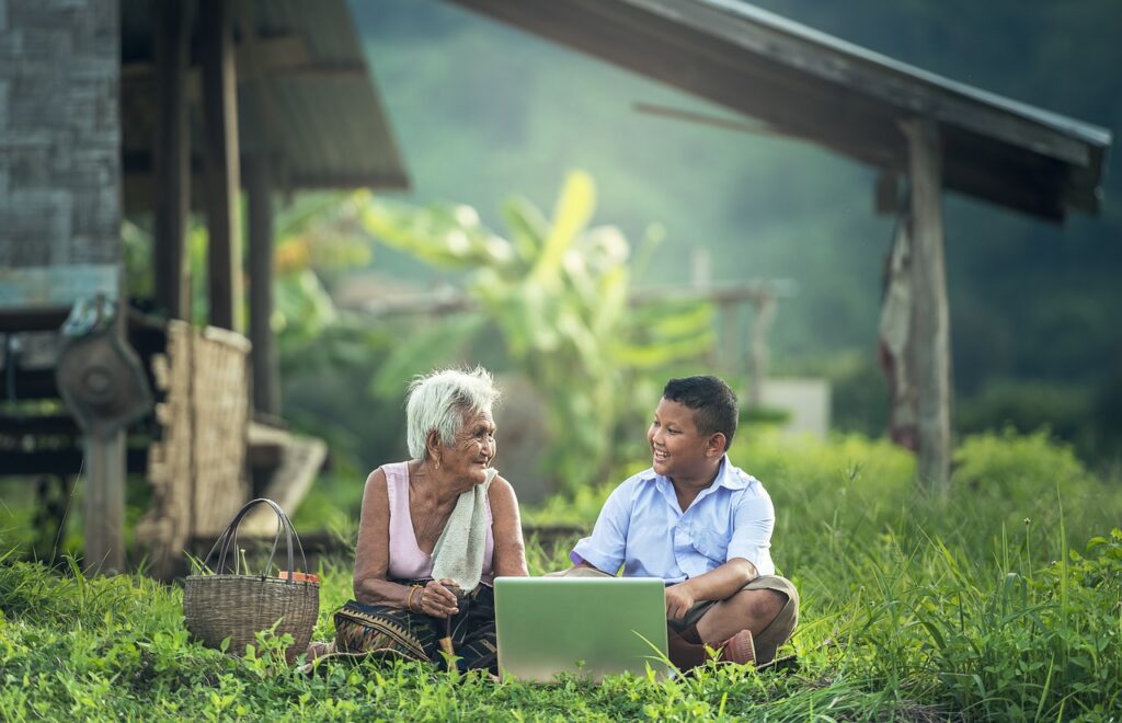 Grandmother talking to her grandson showing the generational communication barrier.