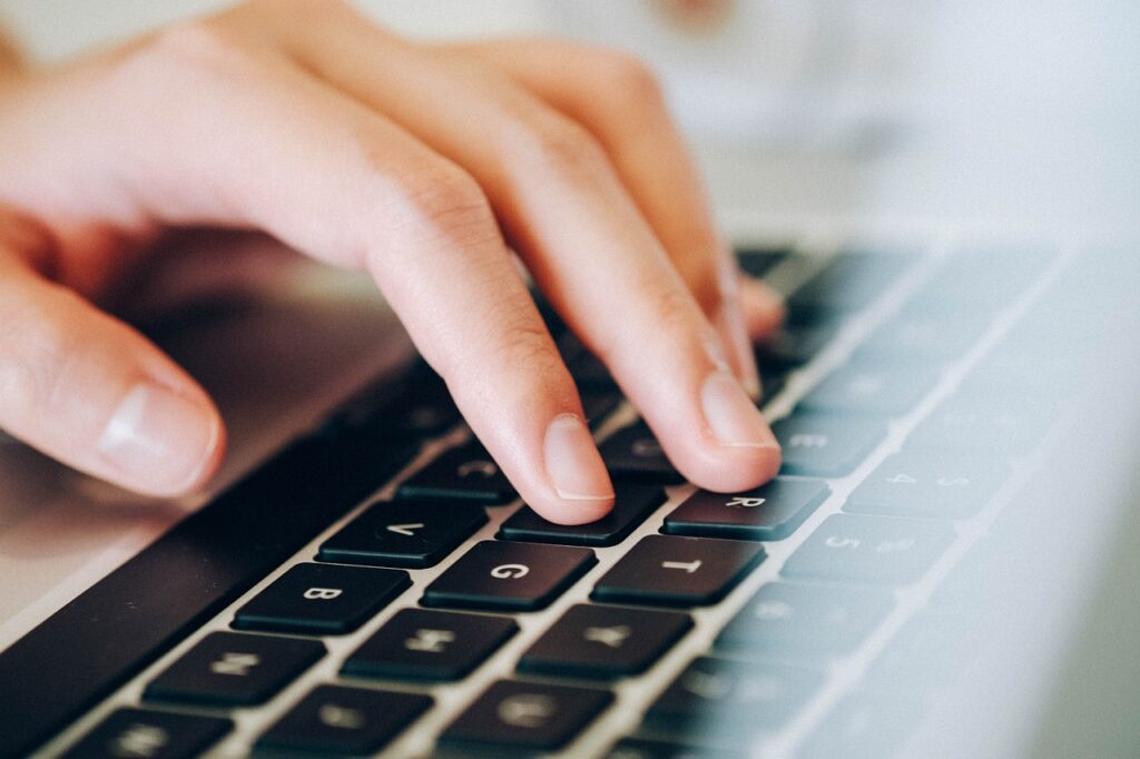 20 Awesome Workforce Planning Tools for Employee Management person looking up some workforce planning tools on a computer.