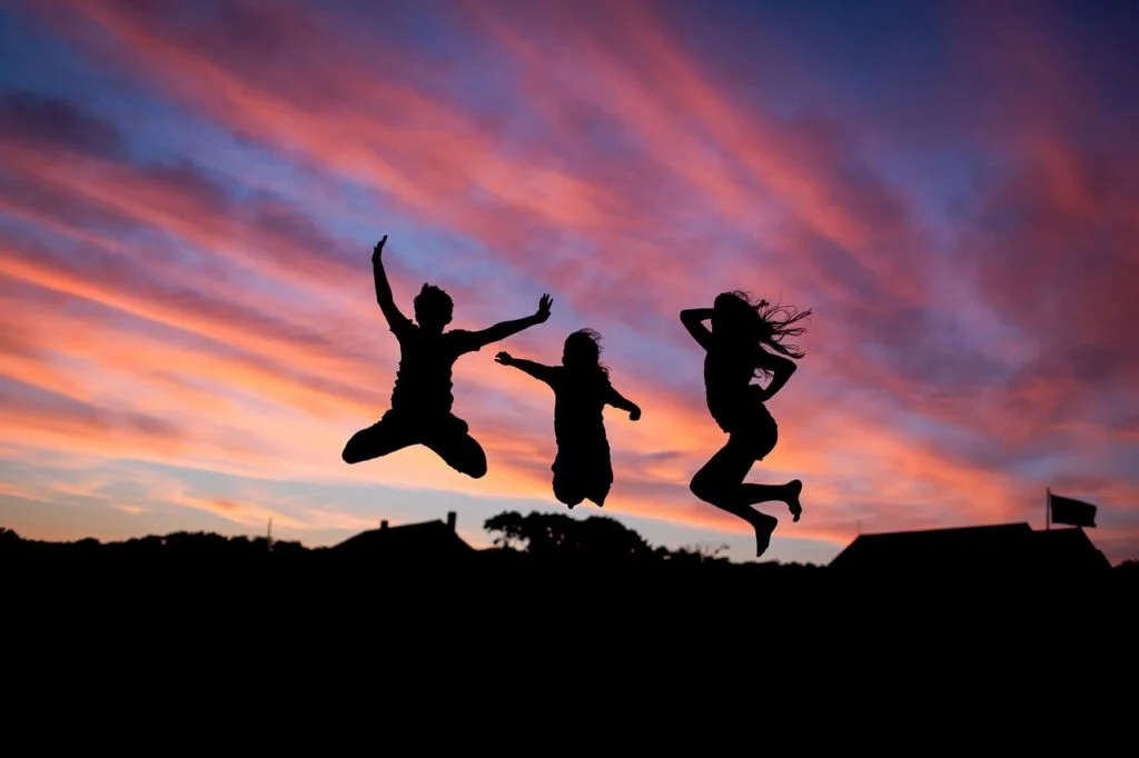 10 Strategies for Enhancing Team Dynamics and Productivity people, jumping, happiness