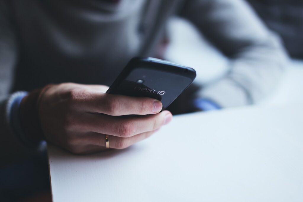 5 Best Team Communication Apps for Collaboration in 2023 man messaging to show the use of team communication apps.