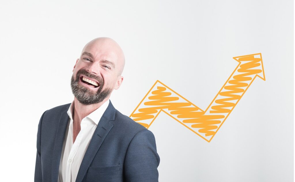 Top Leadership Trends in 2023 That Get Results Man smiling after learning about the top leadership trends.