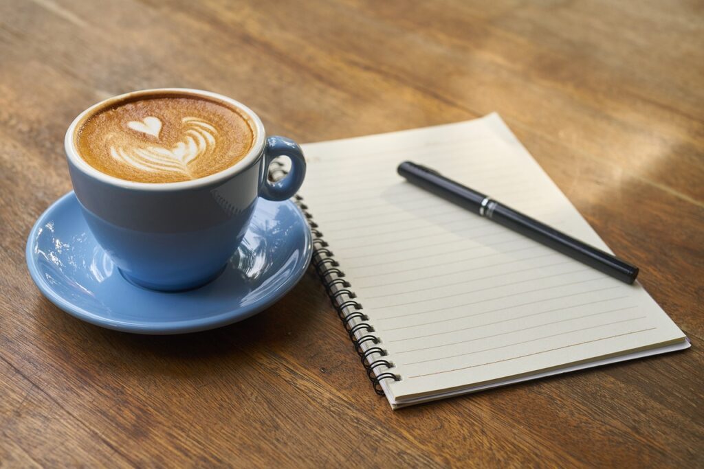 How to Overcome 10 Common Time Management Challenges coffee, pen, notebook