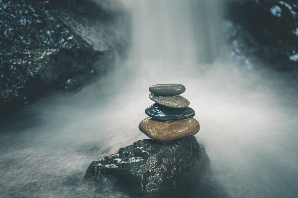 Avoiding Poor Work-Life Balance: Improving Your Well-Being stones, waterfalls, balance