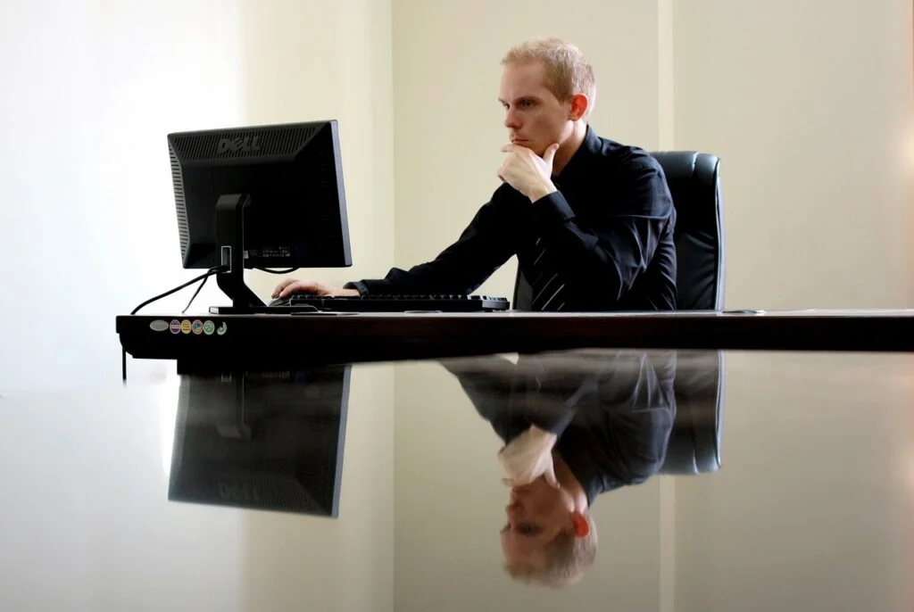 Forward-Thinking Leadership for Organizational Success Man sitting at desk thinking about forward-thinking leadership