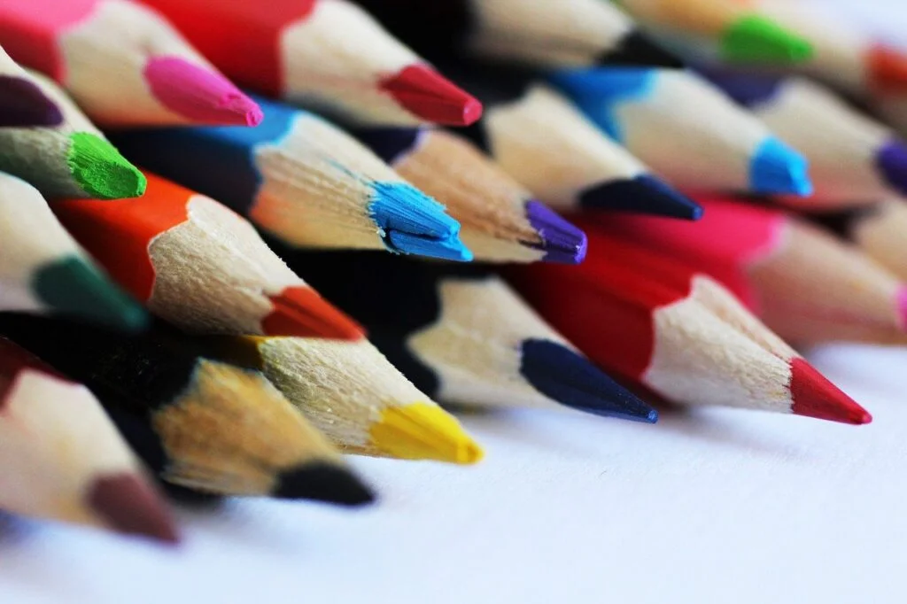Fun Virtual Office Party Games: 14 Creative Ideas color pencils, crayons, colorful drawing office party game