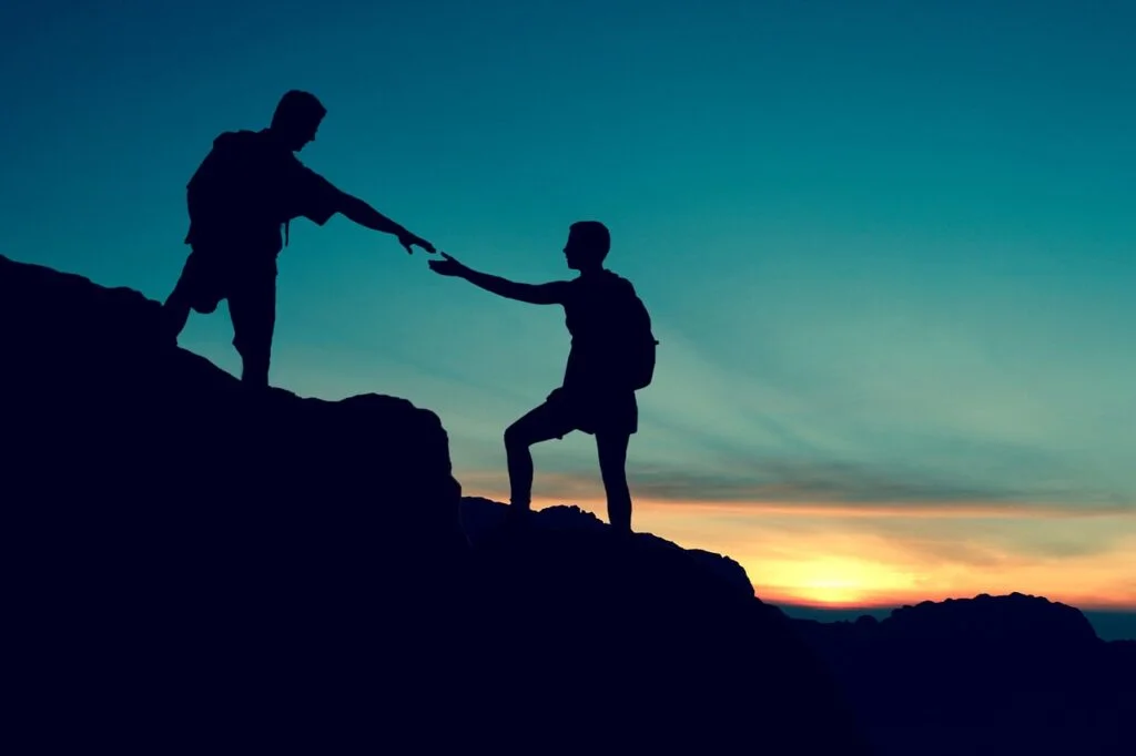 8 Essential Tips for Building Good Character Every Day couple, climbing, help